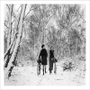 Two Women with Bikes Walking Through Snow Forest - a 17.5 x 12.5cm Christmas Card from Holy Mackerel's Alternative Image Range of Festive Designs.