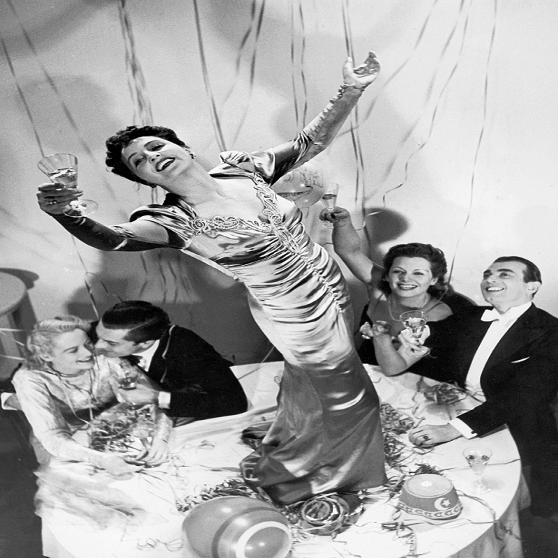 Holy Mackerel cheers retro black and white photographic card featuring a vintage image of dancing on tables at a party - 12.6 x 17.7cm and blank inside