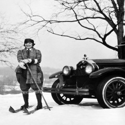 Woman on skis by car - a 17.5 x 12.5cm Christmas Card from Holy Mackerel's Alternative Image Range of Festive Designs.