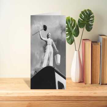 Mop and bucket, black and white photographic card featuring a woman cleaning a caravan - 12.6 x 17.7cm and blank inside - made in the UK