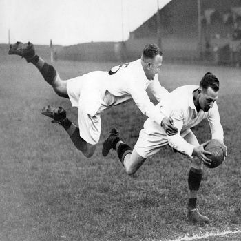 Holy Mackerel heading for the touchline retro black and white photographic card featuring a vintage image of a flying rugby tackle - 12.6 x 17.7cm and blank inside