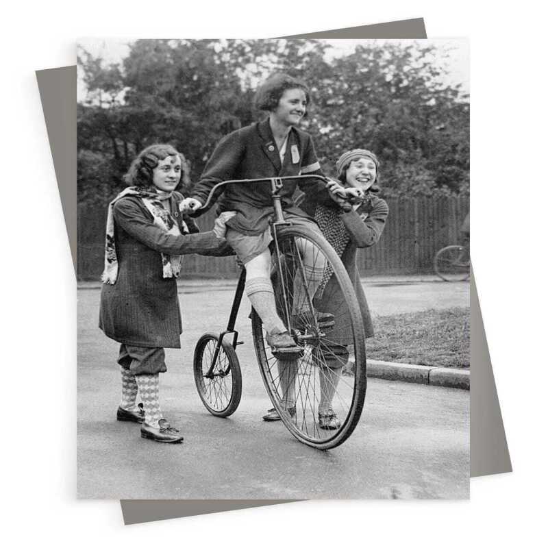 Girls on a penny farthing - vintage black and white themed card - 12.6 x 17.7cm and blank inside - made in the UK