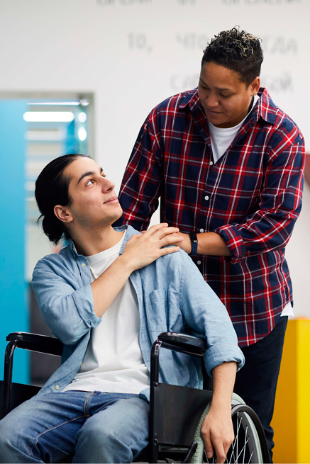 Amore Social Care Support Worker assisting an elderly client in a comfortable residential environment