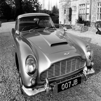 Holy Mackerel Aston Martin retro black and white photographic card featuring a vintage image of James Bond themed classic car with registration 007 JB - 12.6 x 17.7cm and blank inside