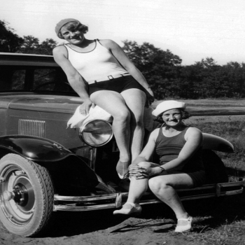 Holy Mackerel two women on a car retro black and white photographic card featuring a vintage image of friends with their vintage automobile - 12.6 x 17.7cm and blank inside