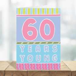 60 years young, a bright and fun 60th birthday card with a gorgeous printed envelope - 12 x 17cm and blank inside - made in the UK