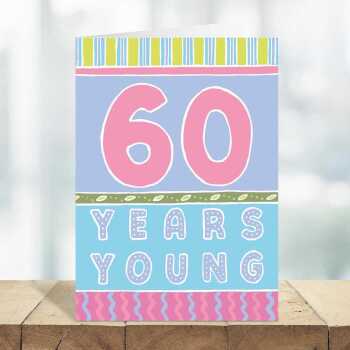 60 years young, a bright and fun 60th birthday card with a gorgeous printed envelope - 12 x 17cm and blank inside - made in the UK