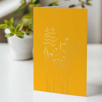 A floral greeting card with buttercups & grasses embellished with gold foil -  designed by artist Eloise Hall - 15.7 x 11cm and blank inside