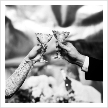 Holy Mackerel two wedding glasses retro black and white photographic card featuring a vintage image of a bride and groom holding champagne coups - 15cm square and blank inside