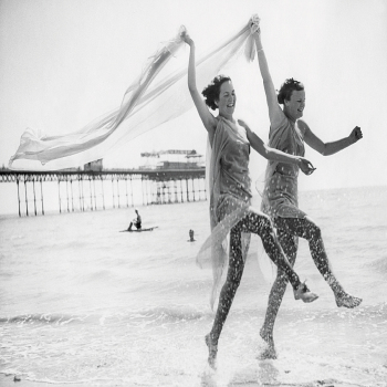 Holy Mackerel prancing past the pier retro black and white photographic card featuring a vintage image of dancing at the beach - 12.6 x 17.7cm and blank inside