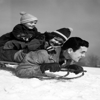 Dad & Two Children on Sledge - a 17.5 x 12.5cm Christmas Card from Holy Mackerel's Alternative Image Range of Festive Designs.