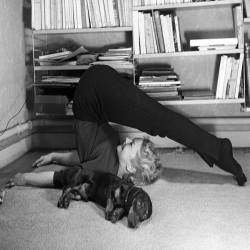 Holy Mackerel exercising together retro black and white photographic card featuring a vintage image of a woman keeping fit while her dog sleeps - 12.6 x 17.7cm and blank inside