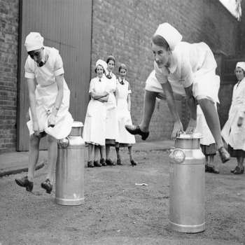 Holy Mackerel milkmaids a leaping retro black and white photographic card featuring a vintage image of girls leapfrogging milk churns - 12.6 x 17.7cm and blank inside