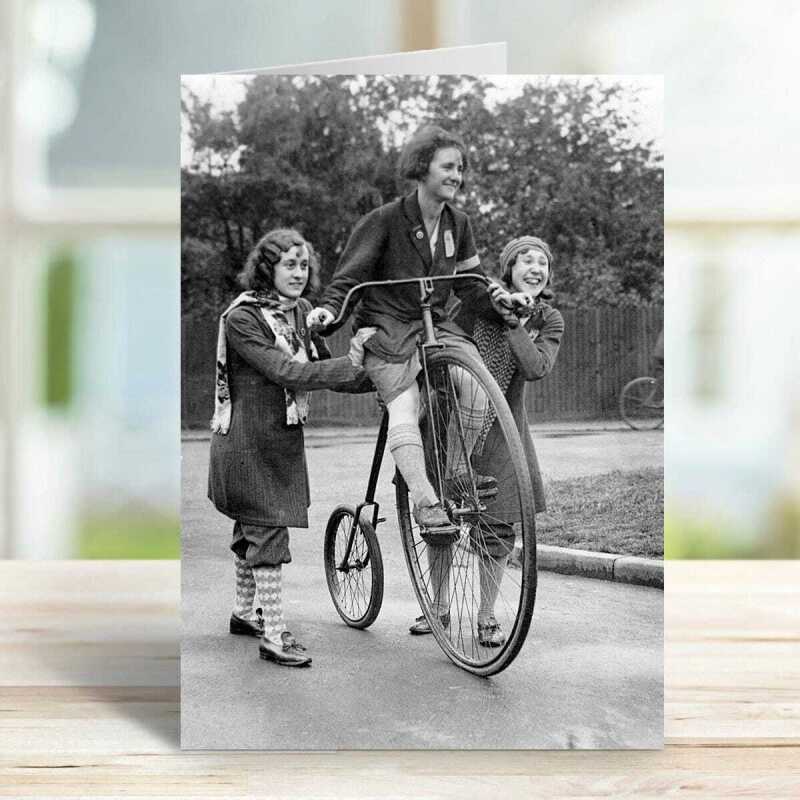 Girls on a penny farthing - vintage black and white themed card - 12.6 x 17.7cm and blank inside - made in the UK