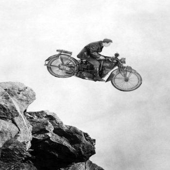 Holy Mackerel stunt motorbike retro black and white photographic card featuring a vintage image of a motorcycle jump - 12.6 x 17.7cm and blank inside
