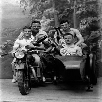 Holy Mackerel four lads with their beers retro black and white photographic card featuring a vintage image of men posing with drinks in a motorbike and sidecar - 12.6 x 17.7cm and blank inside