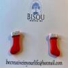 Cute little red clay Christmas stockings with a white silver glitter detail.