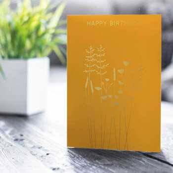 Happy birthday card with a pretty gold foil buttercups and grass  print - designed by artist Eloise Hall - 15.7 x 11cm and blank inside