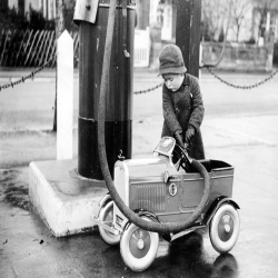 Holy Mackerel filling up retro black and white photographic card featuring a vintage image of children with their toy car - 12.6 x 17.7cm and blank inside