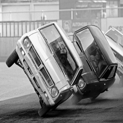 Holy Mackerel automobile stunt retro black and white photographic card featuring a vintage image of cars balanced on two wheels - 12.6 x 17.7cm and blank inside