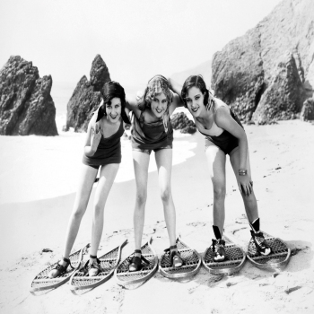 Holy Mackerel snowshoes on the beach retro black and white photographic card featuring a vintage image of models with unusual seaside footwear - 12.6 x 17.7cm and blank inside