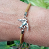 Gold kids bracelet with a Bird Charm