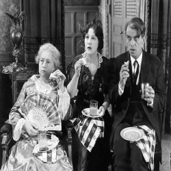 Holy Mackerel Jaw dropping news retro black and white photographic card featuring a vintage image of people eating sandwiches and looking gobsmacked - 12.6 x 17.7cm and blank inside