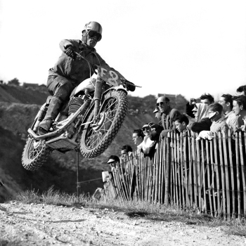 Holy Mackerel motorbike jump retro black and white photographic card featuring a vintage image of a bike stunt - 15cm square and blank inside