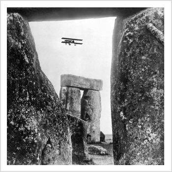 Holy Mackerel Stonehenge retro black and white photographic card featuring a vintage image of a biplane flying over the historic site - 15cm square and blank inside
