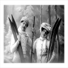 Couple Wearing Hats and Carrying skis - a 17.5 x 12.5cm Christmas Card from Holy Mackerel's Alternative Image Range of Festive Designs.