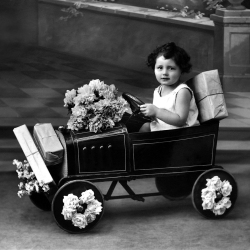 Holy Mackerel present delivery retro black and white photographic card featuring a vintage image of a child and her toy car - 15cm square and blank inside