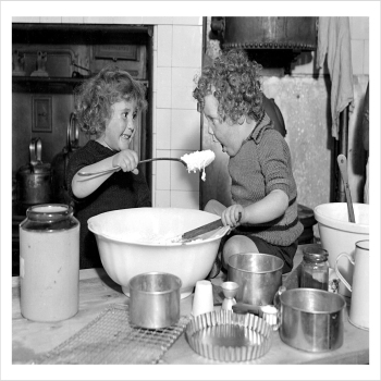 Helping with the Christmas pudding, a 127 x 175mm Alternative Image cookery themed Christmas card featuring a vintage black and white photo, message inside says Happy Christmas