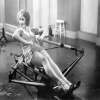 Holy Mackerel oarswoman practising retro black and white photographic card featuring a vintage image of a woman on a rowing machine - 12.6 x 17.7cm and blank inside