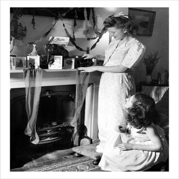 Two Women by Fireplace - a 17.5 x 12.5cm Christmas Card from Holy Mackerel's Alternative Image Range of Festive Designs.