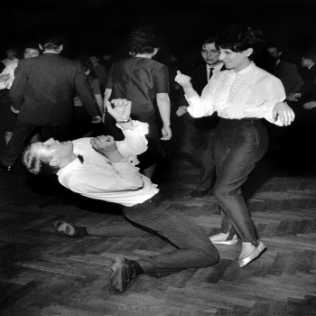 Holy Mackerel couple doing the twist retro black and white photographic card featuring a vintage image of a man and a woman dancing - 12.6 x 17.7cm and blank inside