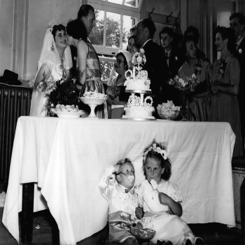 Holy Mackerel under the table at the wedding retro black and white photographic card featuring a vintage image of a hungry bridesmaid and pageboy - 12.6 x 17.7cm and blank inside