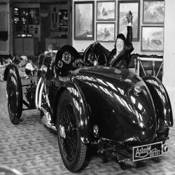 Holy Mackerel Aston Martin retro black and white photographic card featuring a vintage image of a classic car in the showroom - 12.6 x 17.7cm and blank inside