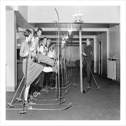 Indoor skiing lesson, a 127 x 175mm Alternative Image winter themed Christmas card featuring a vintage black and white photo, message inside says Happy Christmas