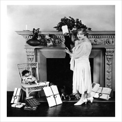 Woman by Chimney with Presents - a 17.5 x 12.5cm Christmas Card from Holy Mackerel's Alternative Image Range of Festive Designs.