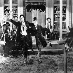 Holy Mackerel Way out West retro black and white photographic card featuring a vintage image of Laurel and Hardy in a still from a classic comedy film - 12.6 x 17.7cm and blank inside