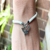 White kids bracelet with a Butterfly Charm