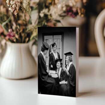 Graduates, black and white graduation card featuring female students with chocolates - 12.6 x 17.7cm and blank inside - made in the UK