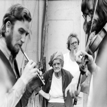 Holy Mackerel infuriated by a fiddler retro black and white photographic card featuring a vintage image of old ladies watching musicians at the Eisteddfod - 12.6 x 17.7cm and blank inside