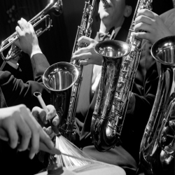 Holy Mackerel jazz ensemble retro black and white photographic card featuring a vintage image of saxophones and a trumpet - 12.6 x 17.7cm and blank inside