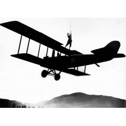 Holy Mackerel stuntwoman retro black and white photographic card featuring a vintage image of a wingwalker performing a stunt on a biplane - 12.6 x 17.7cm and blank inside