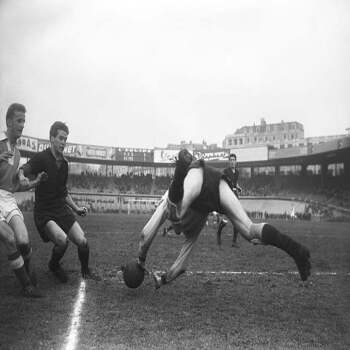 Holy Mackerel rearguard defence retro black and white photographic card featuring a vintage image of flying rugby players - 12.6 x 17.7cm and blank inside