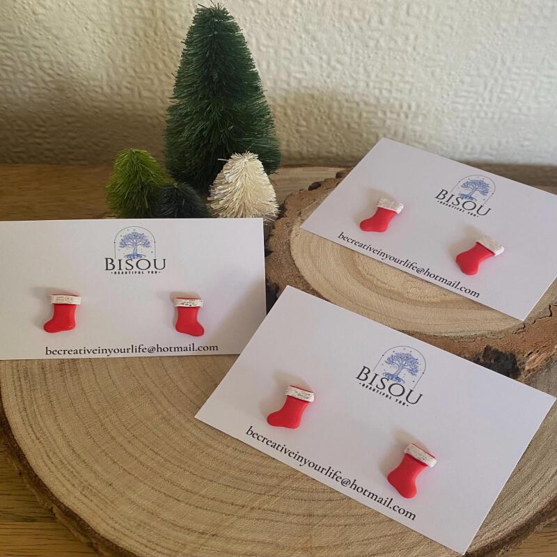Cute little red clay Christmas stockings with a white silver glitter detail.