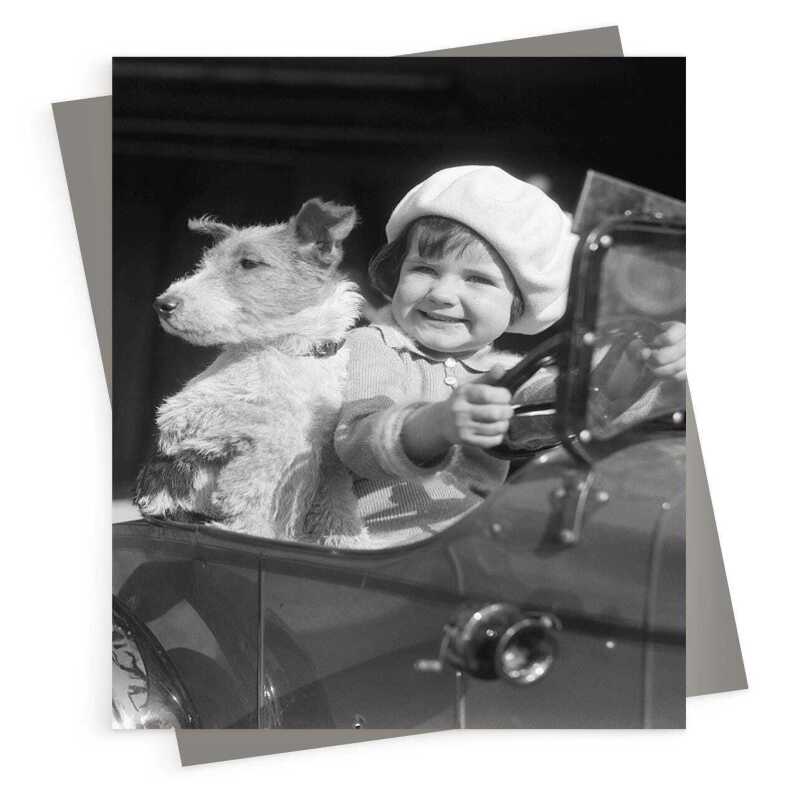 Little girl and dog in toy car - vintage black and white themed card - 12.6 x 17.7cm and blank inside - made in the UK
