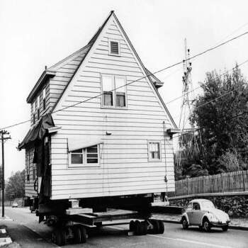 Holy Mackerel house on the move retro black and white photographic card featuring a vintage image of a building being transported - 12.6 x 17.7cm and blank inside