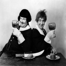 Holy Mackerel Laurel and Hardy rasing a glass retro black and white photographic card featuring a vintage image of a film still of the comedy actors - 12.6 x 17.7cm and blank inside